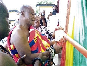  Nana Kwaku Budu Akomia, the Chief of Atimpoku, cutting the tape to inaugurate the facility at Atimpoku